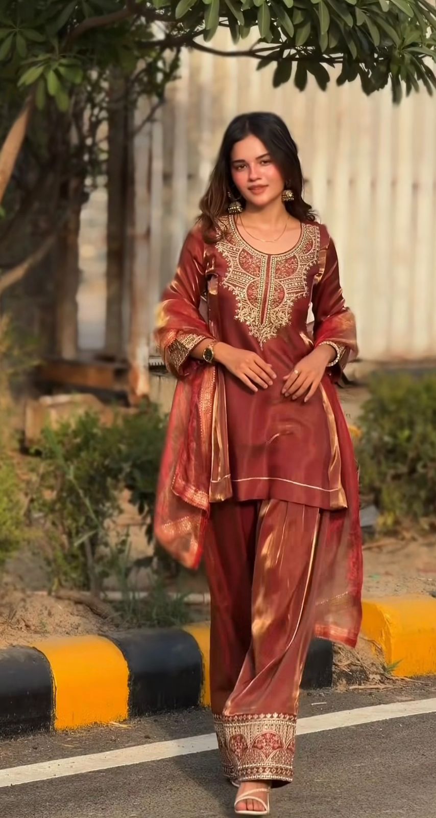 SW193 Rust red fandy silk embroidery farshi salwar suit worn view outdoor