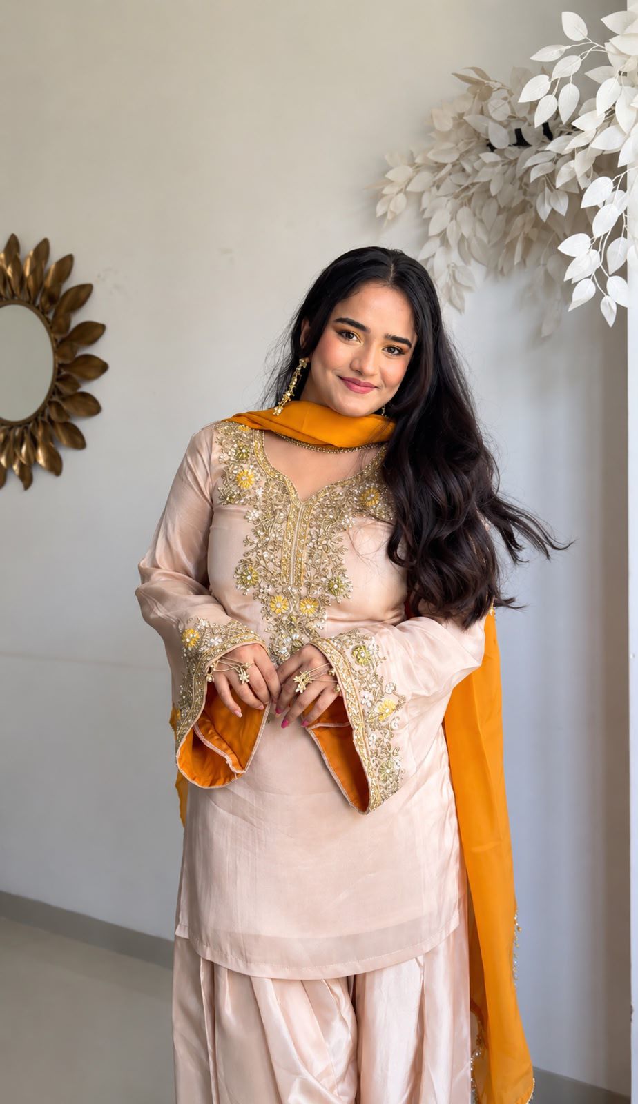 Close-up of embroidery thread and moti work on kurti