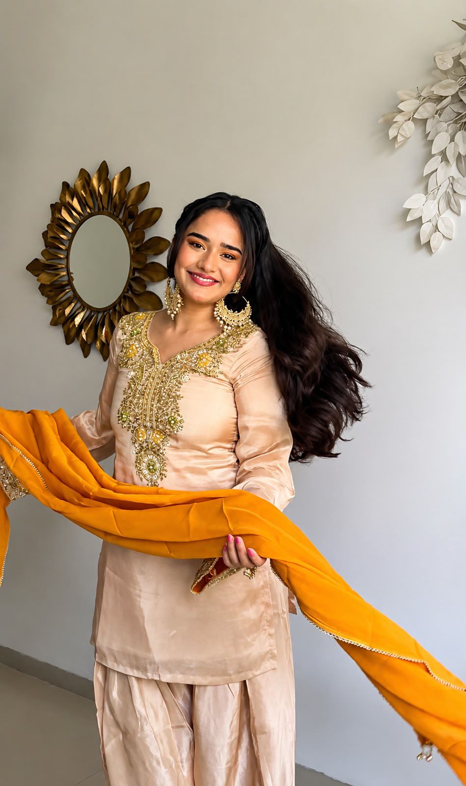 Side view of peach salwar suit with mustard dupatta