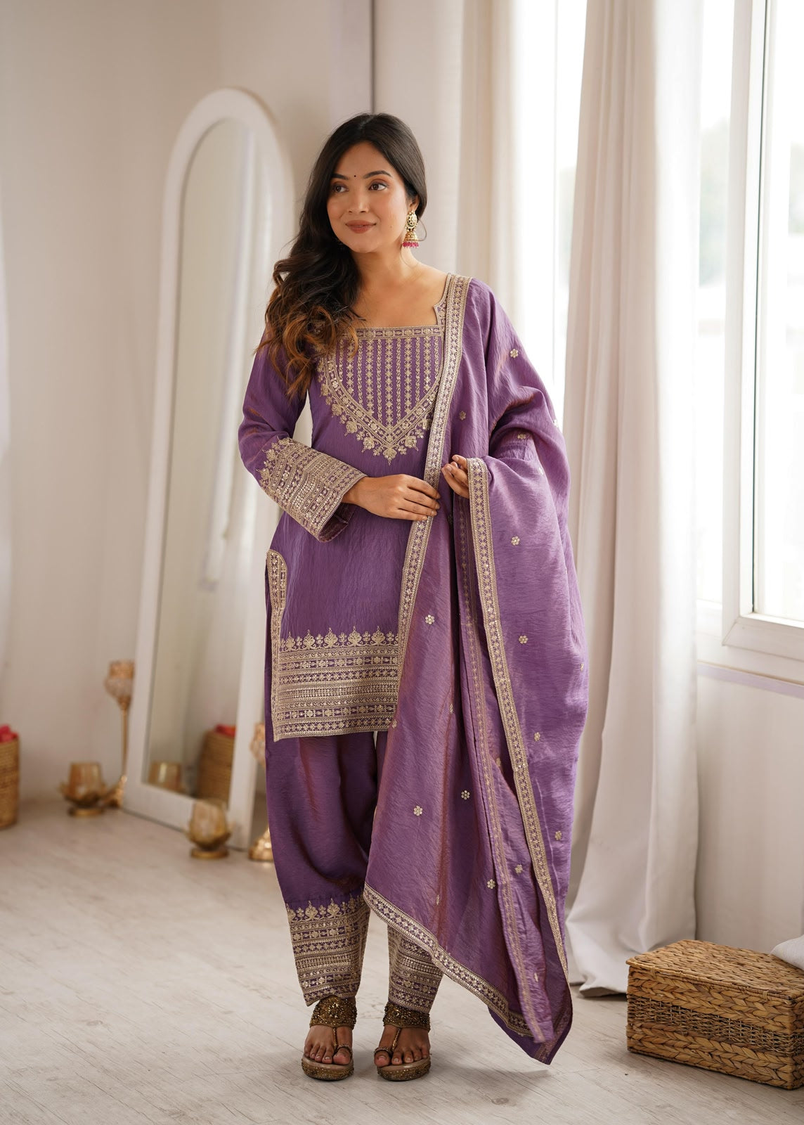 Flat lay of onion pink vichitra silk suit with dupatta and farshi shalwar