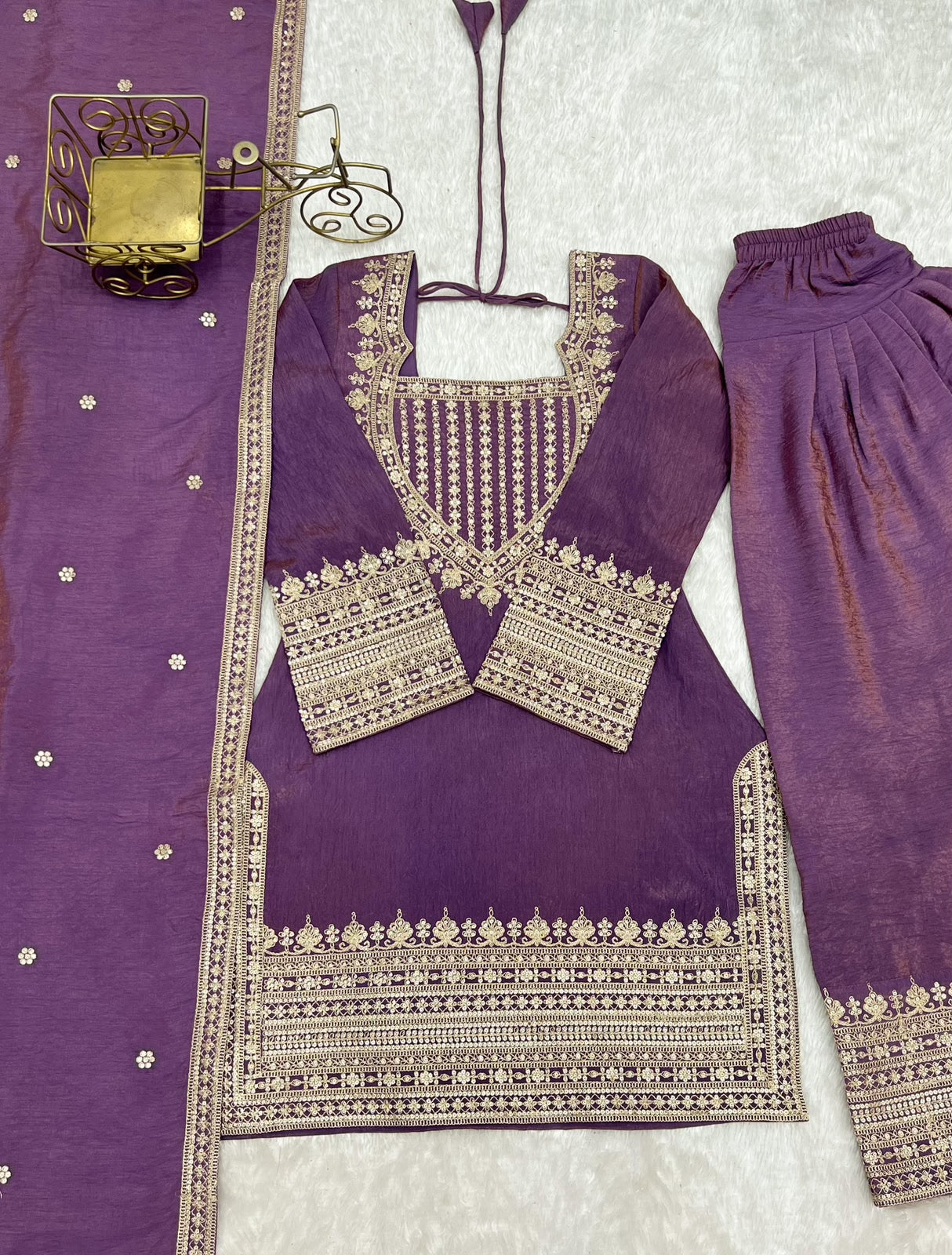Sea green suit set flat lay close-up showing embroidery detail