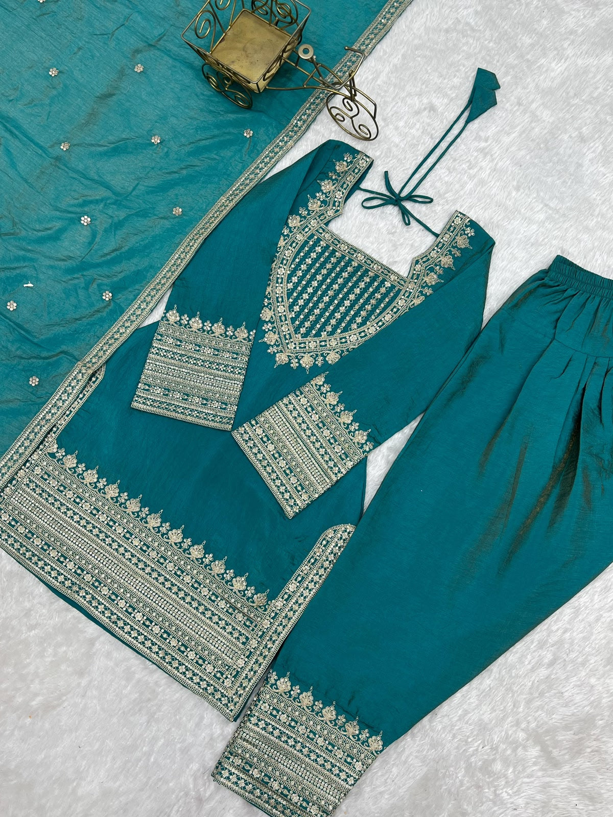 Sea green embroidered kurta flat lay with sequence and dori work