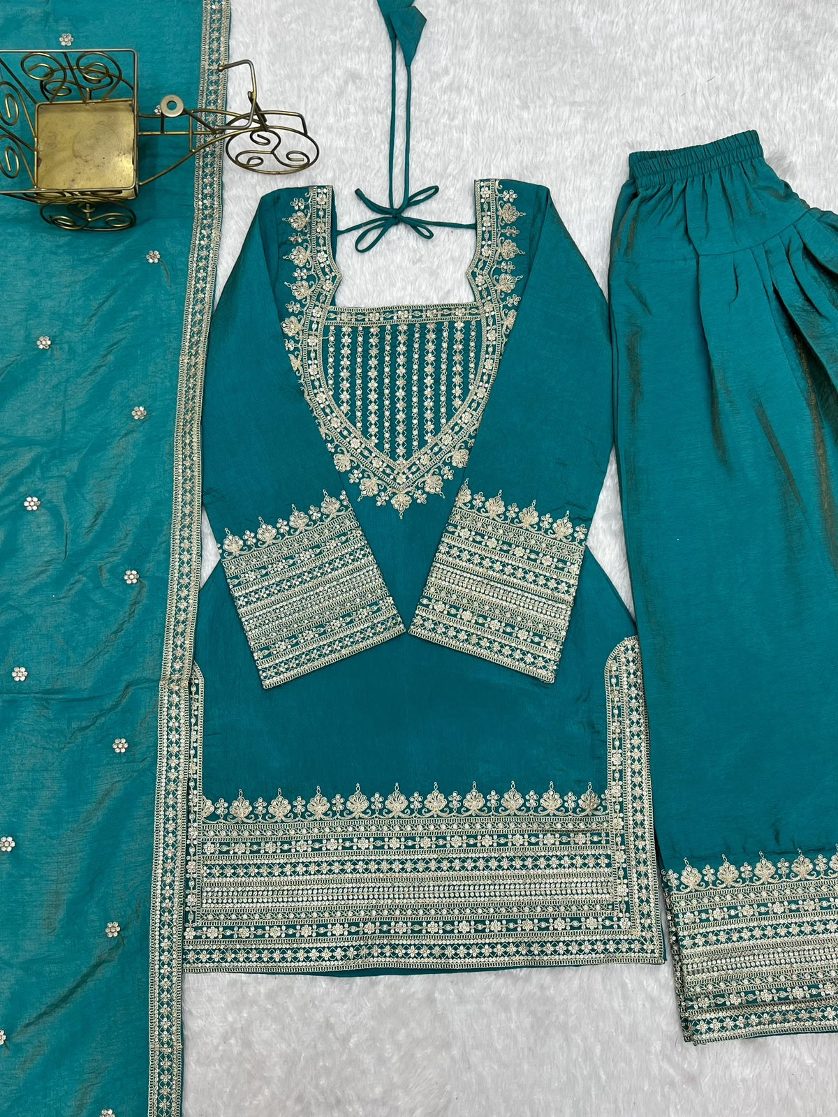 Sea green suit set flat lay showing full yoke embroidery pattern