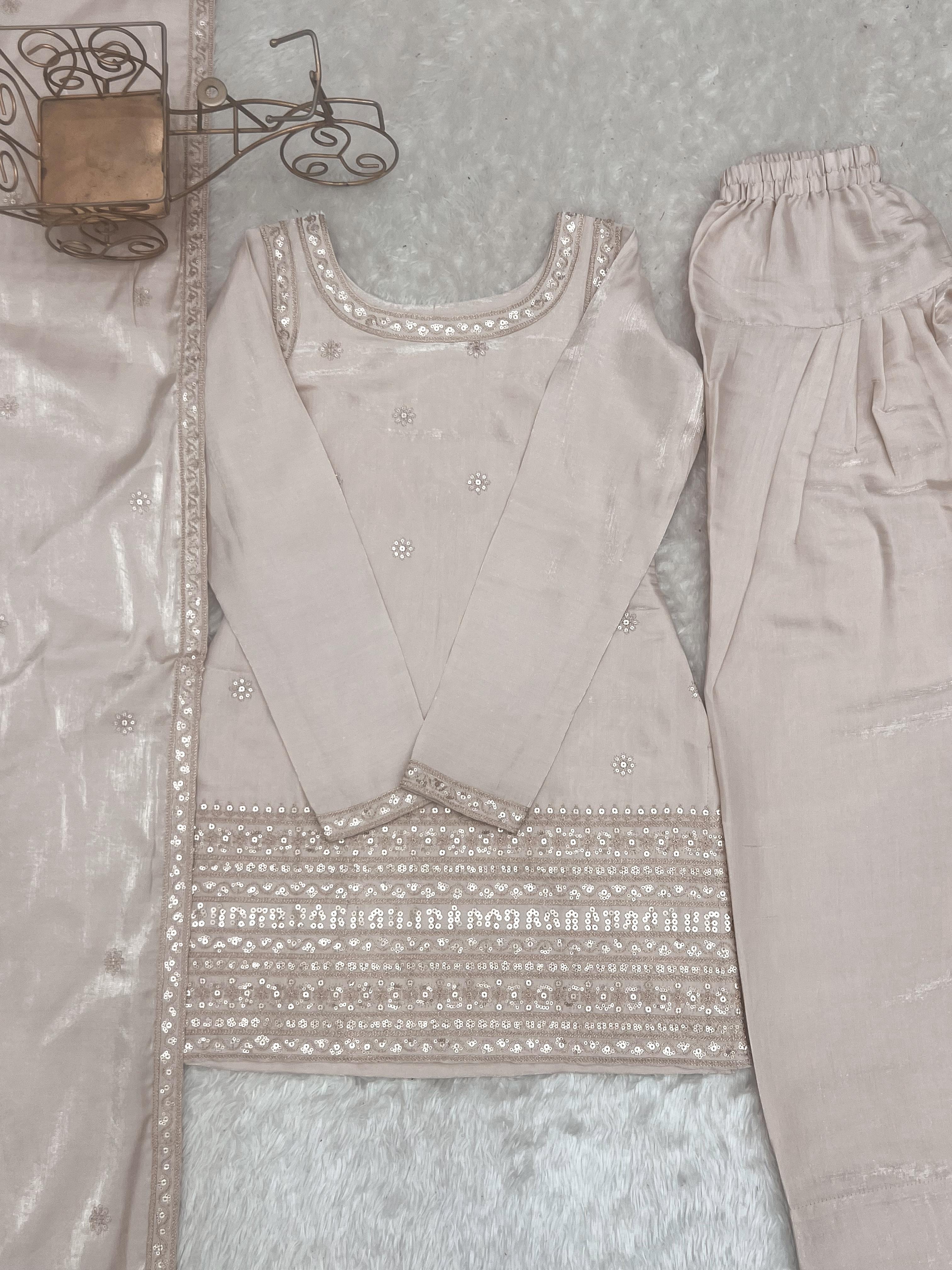 Flat lay of complete cream glass roman silk 3-piece suit set