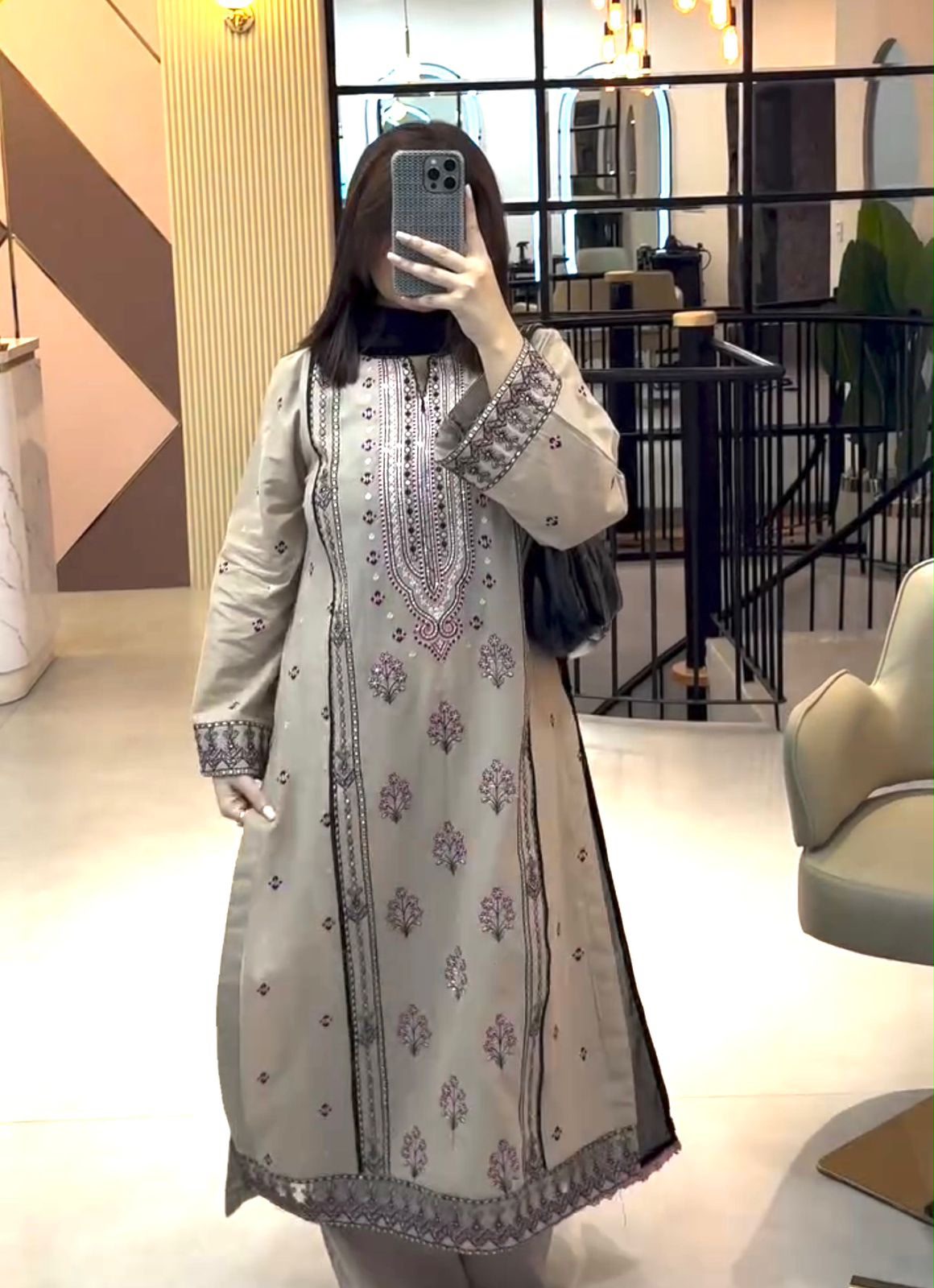Model in beige embroidered suit set full length mirror selfie