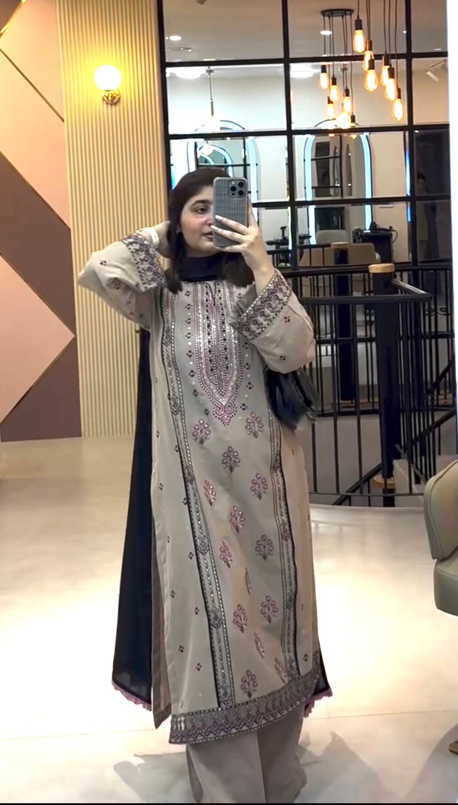 Flat lay of beige embroidered kurta with charcoal dupatta and palazzo