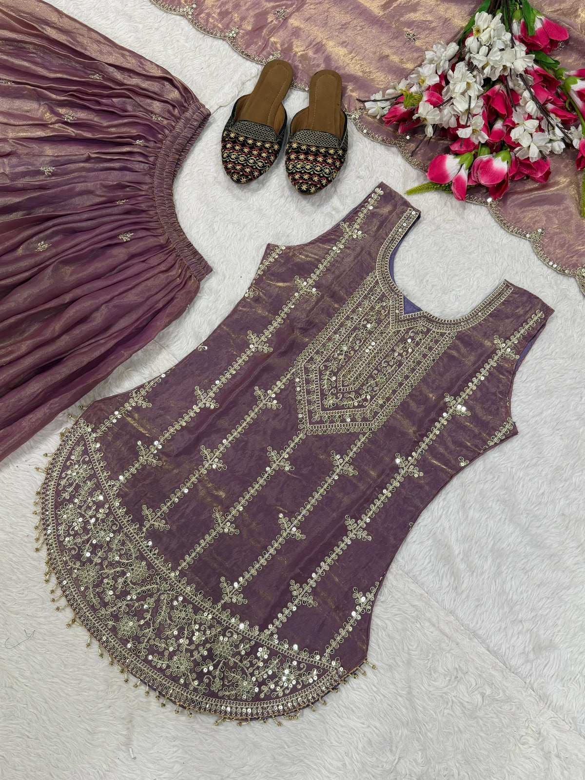 Flat lay of complete mauve 3-piece suit set with sharara and dupatta