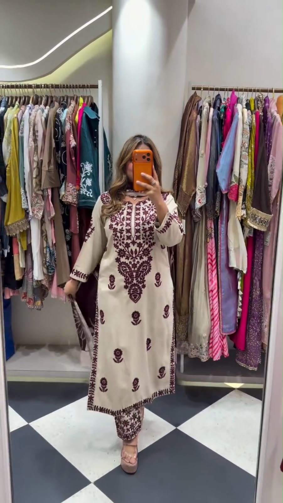 Flat lay of white rayon slub embroidered suit set with wine maroon printed dupatta