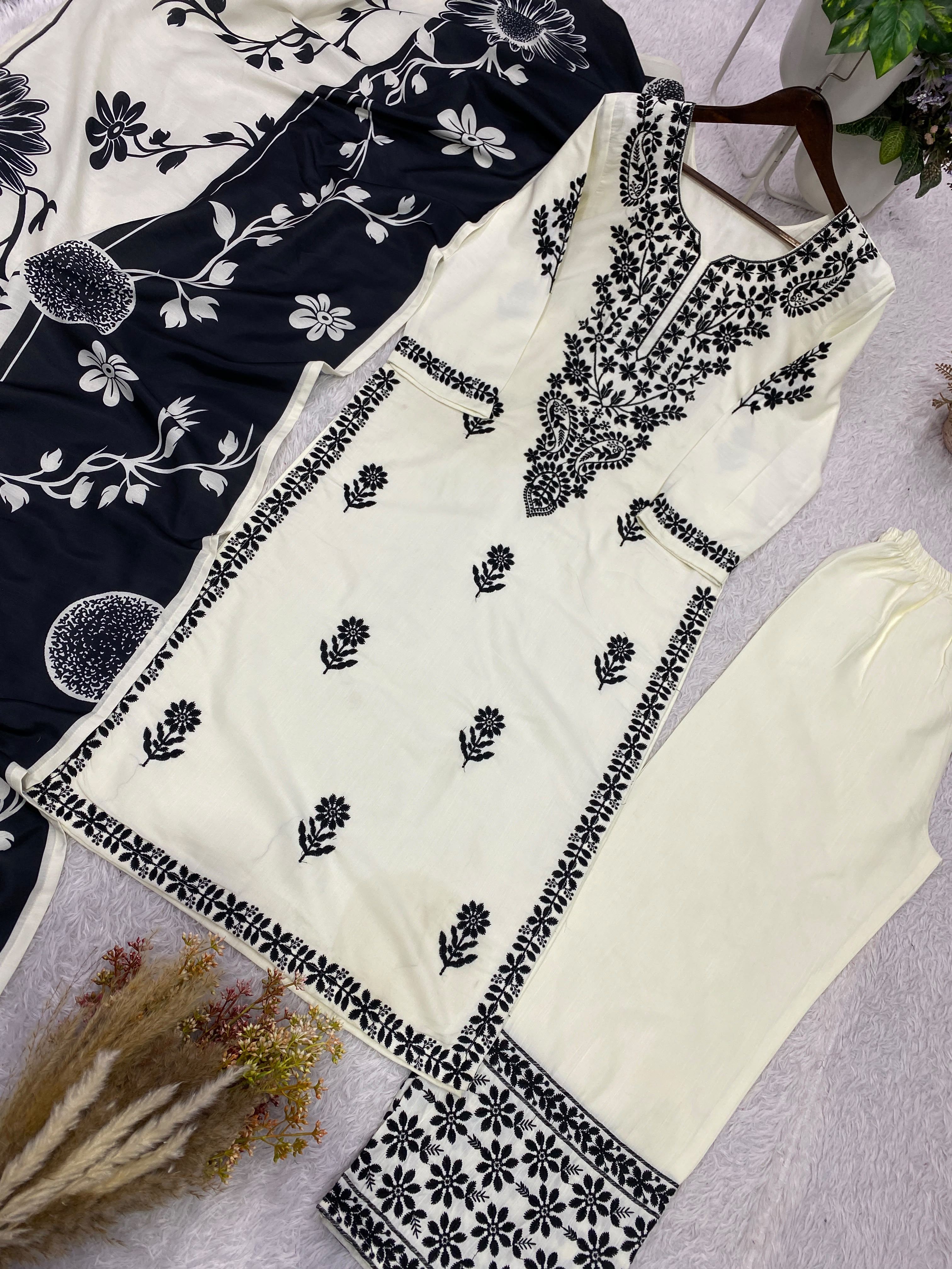 Close-up flat lay of white rayon slub kurta showing full black embroidery yoke pattern