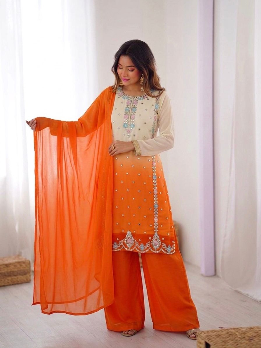 Flat lay of orange ombre embroidered kurta showing sequence work and scalloped hem border