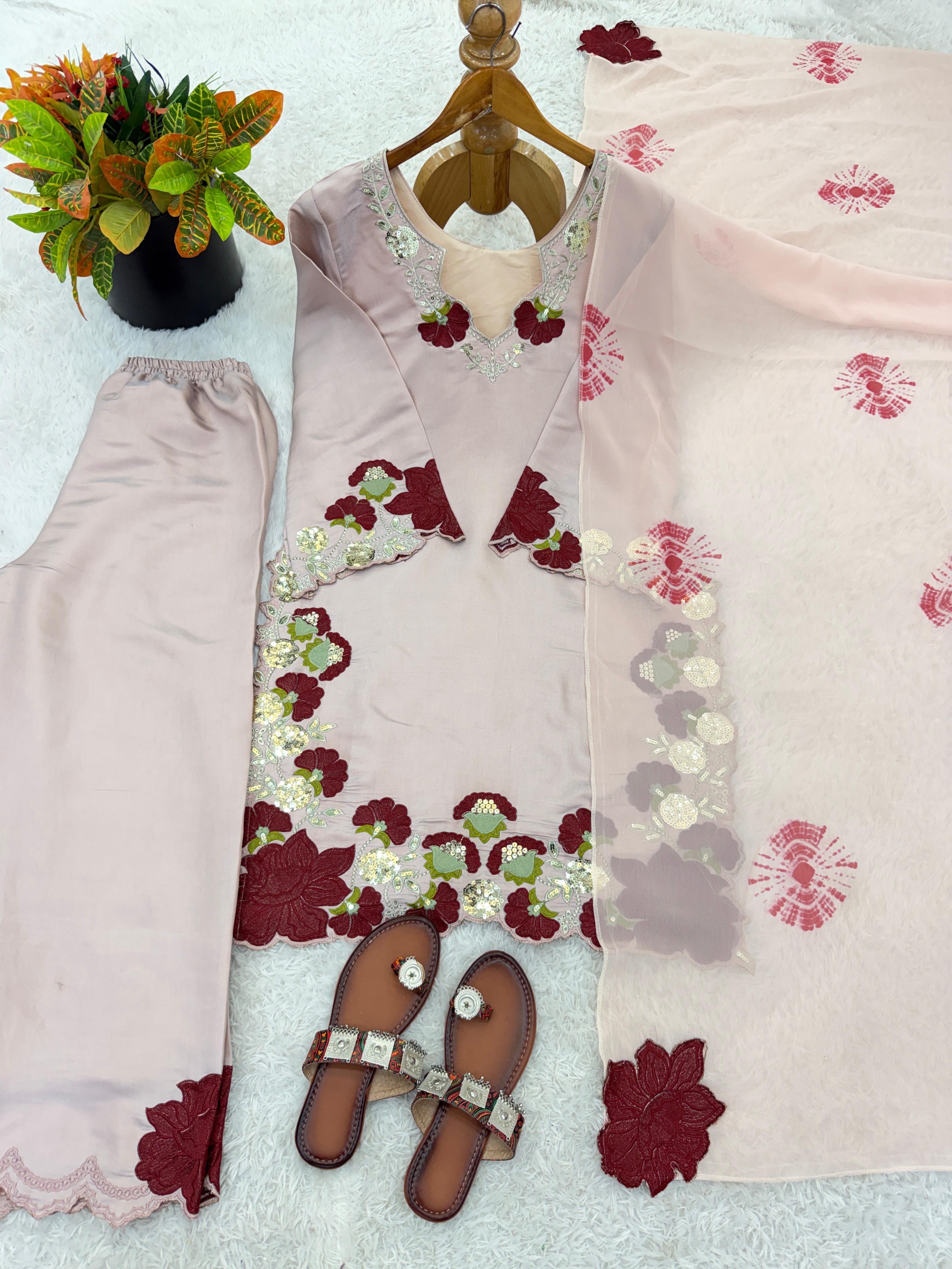 Flat lay of blush pink roman glass suit set showing kurta pant and dupatta arrangement