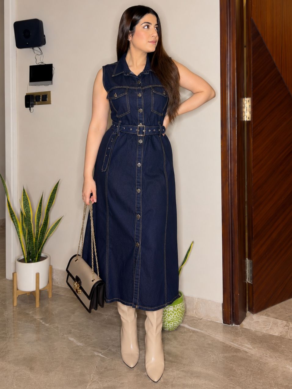 Denim belted midi dress dark navy - model wearing side view with belt and boots