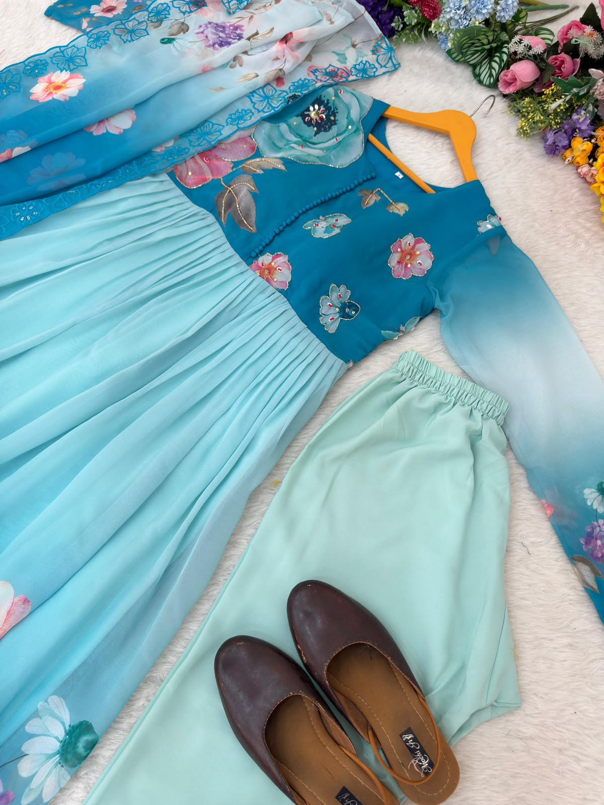 Teal Floral Gown Set - Folded Flat Lay on Rattan Tray