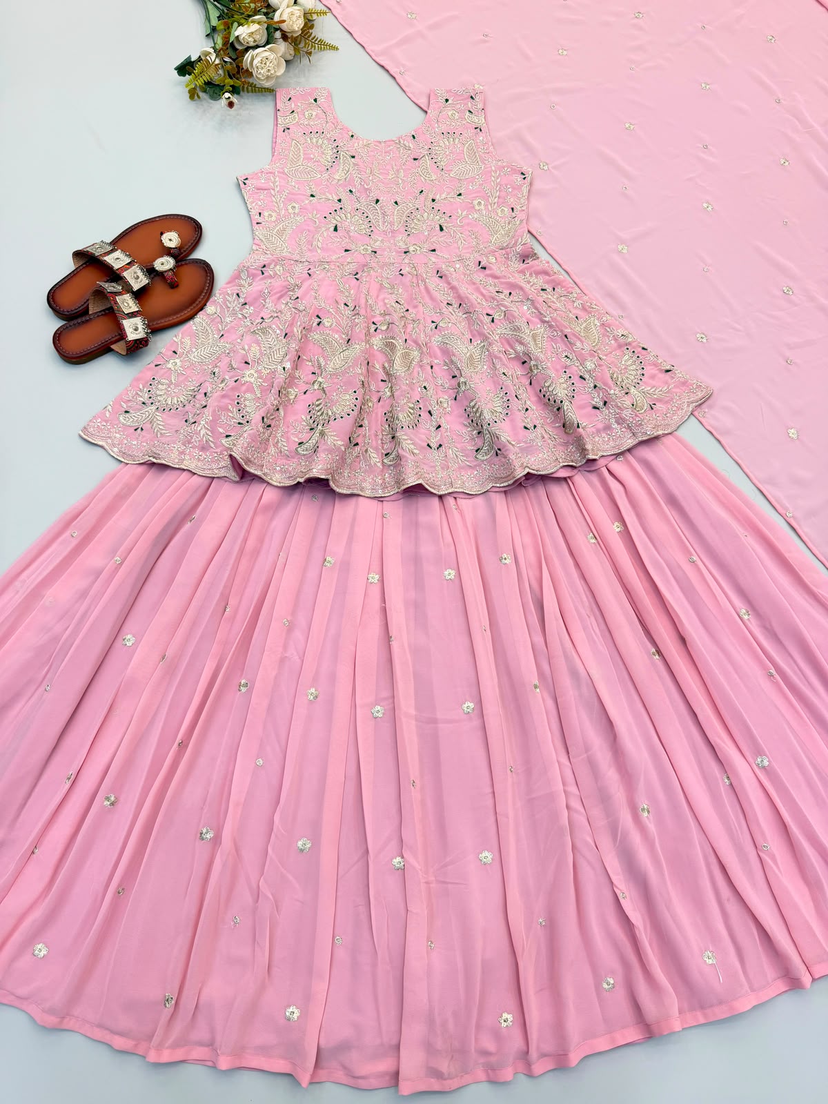 Rose pink peplum top and lehenga flat lay - angle view