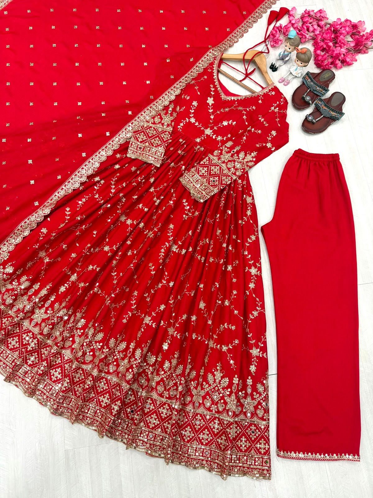 Red anarkali gown - model side pose in boutique