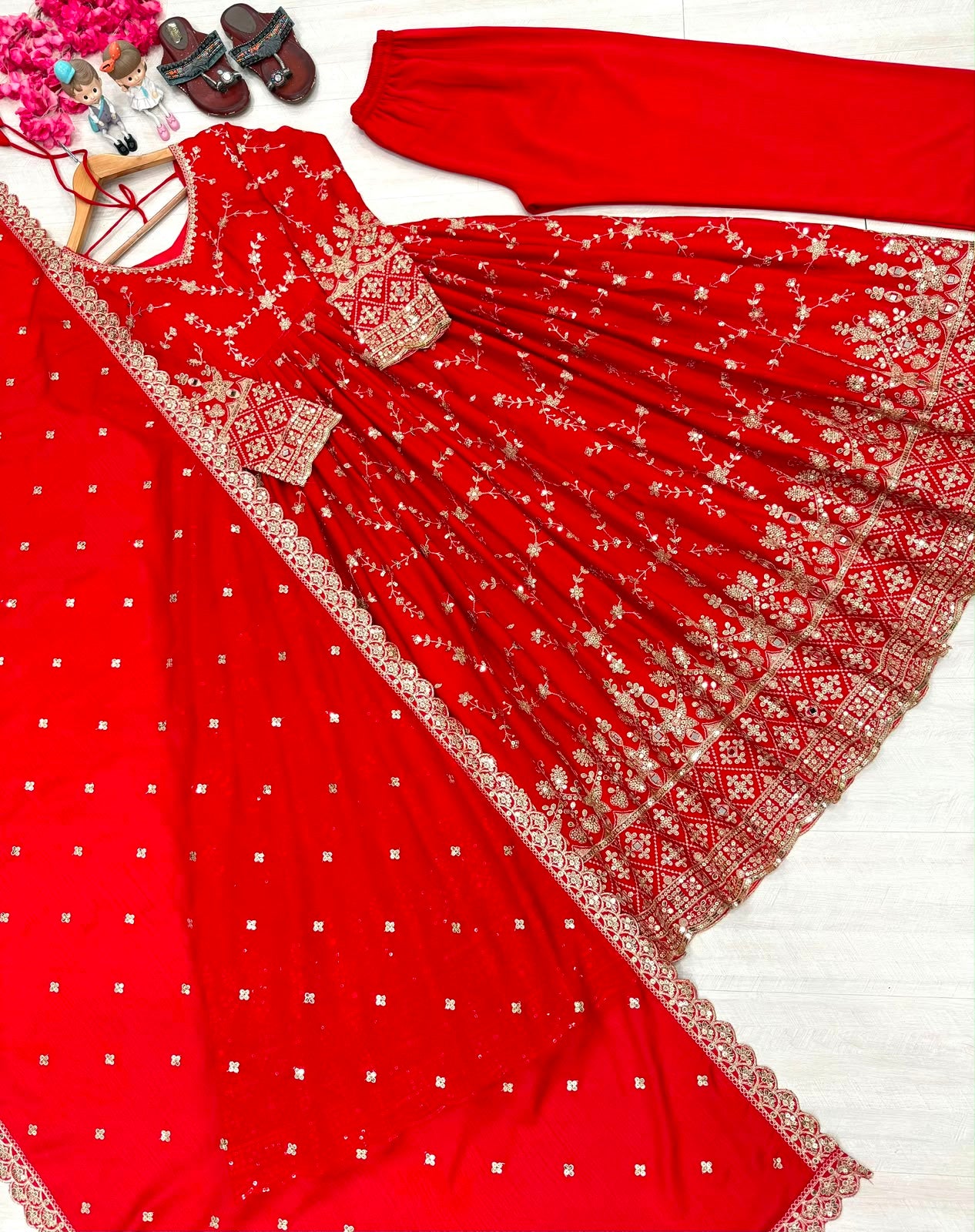 Red anarkali gown - model twirl pose showing flair