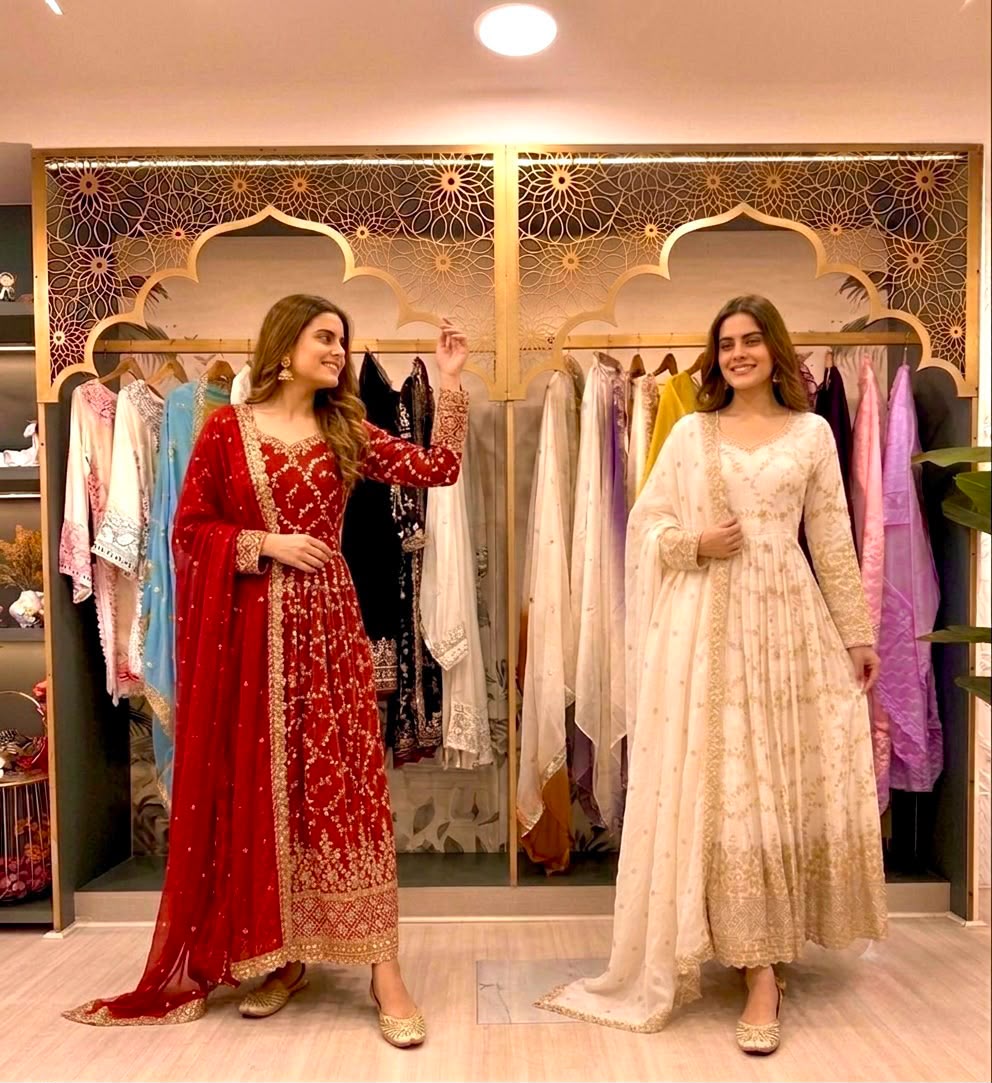 Red and white anarkali gown sets - two models side by side