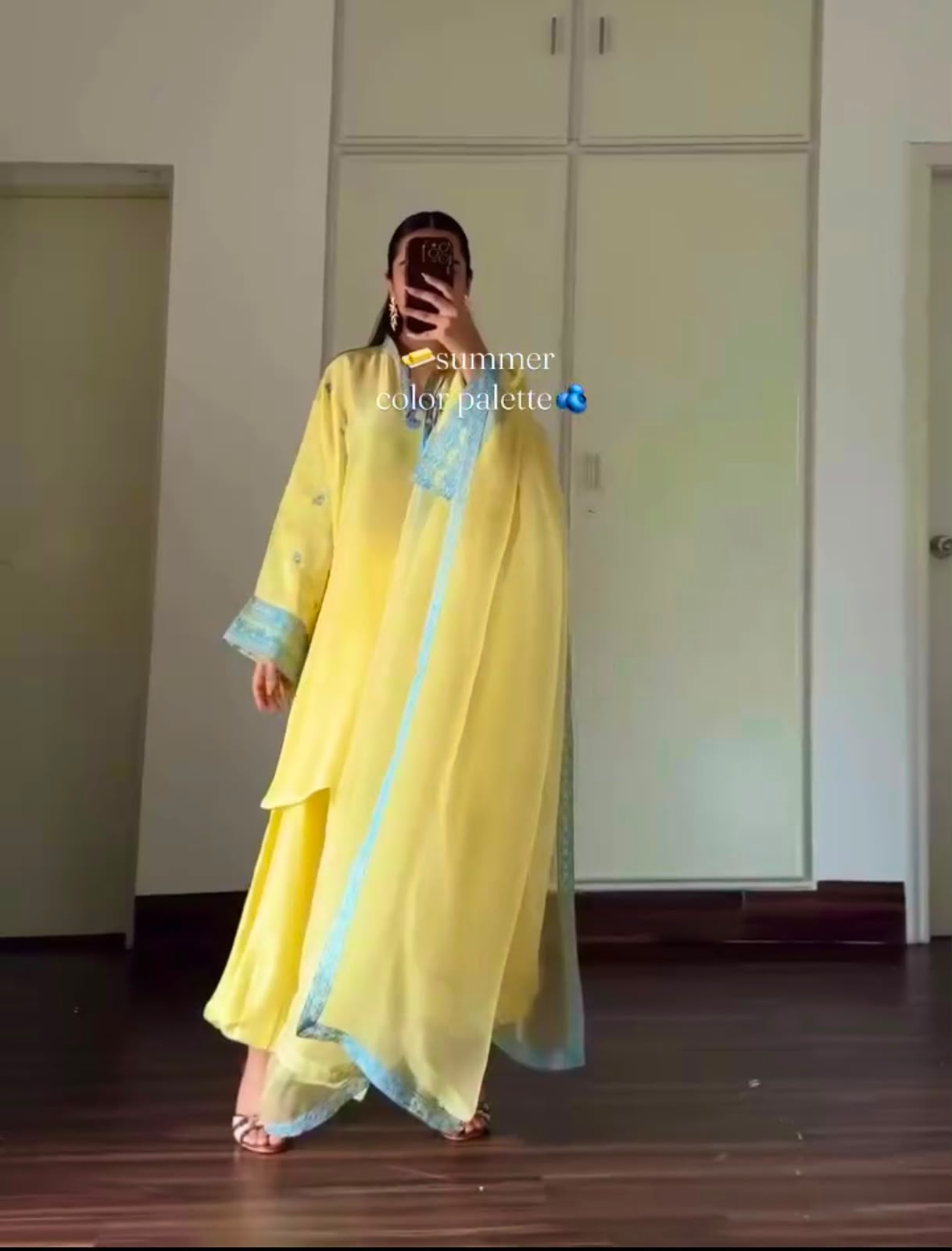 Designer yellow coord set - model seated with dupatta