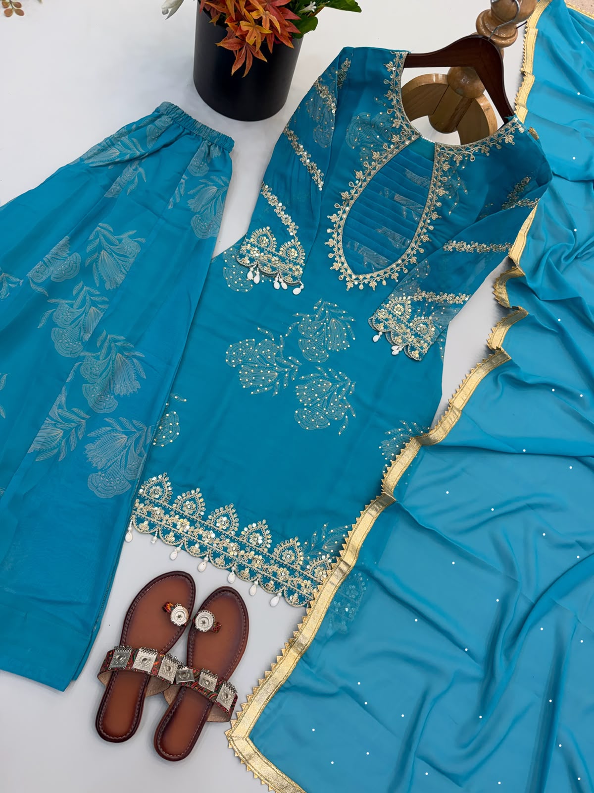 Teal faux georgette embroidery suit set - flat lay kurti and dupatta close up